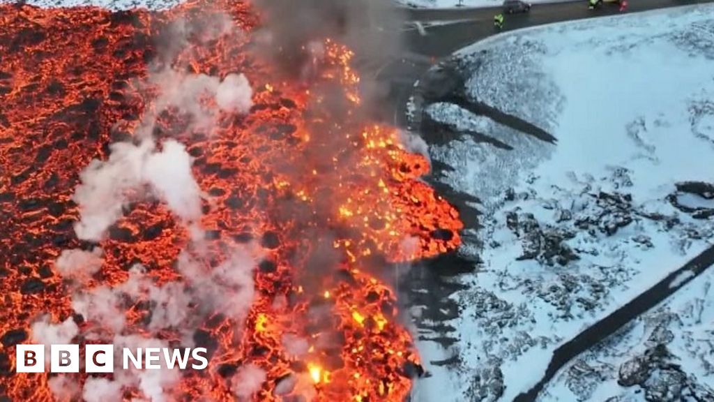 Lava flows over roads and bursts water pipe after Iceland eruption