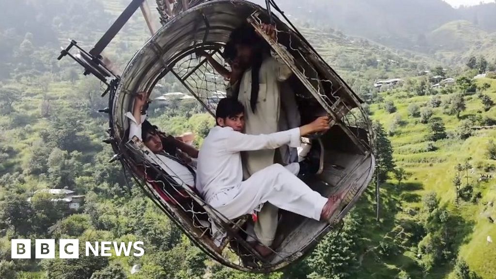 Pakistan cable car: Drone shows people trapped above ravine
