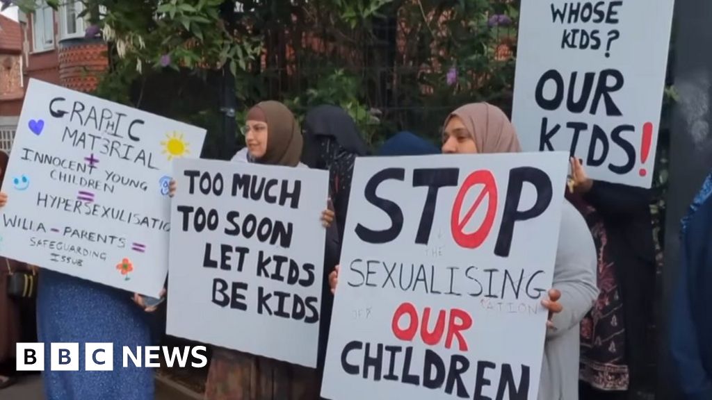 Protestors hold placards saying "stop sexualising our children" and "too much too soon, let kids be kids"