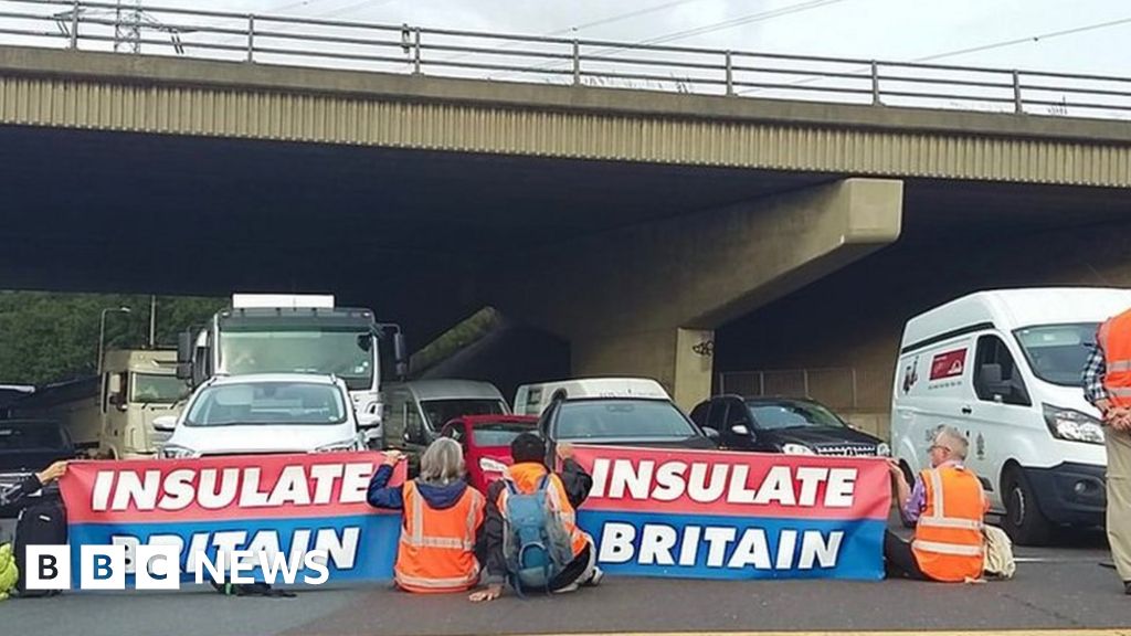 Insulate Britain protesters glue hands to M25