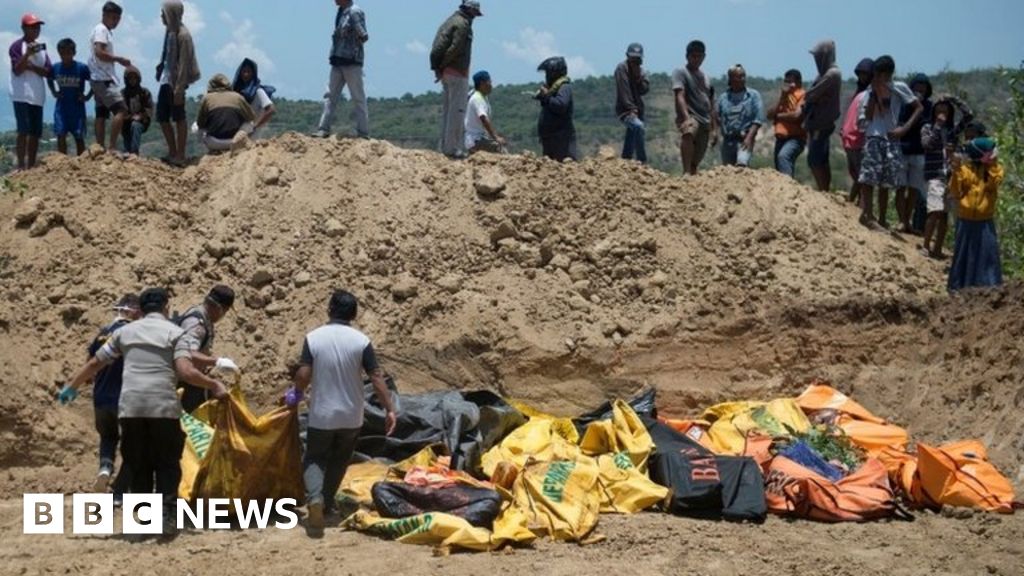 Indonesia Earthquake And Tsunami: Dead Buried In Mass Grave