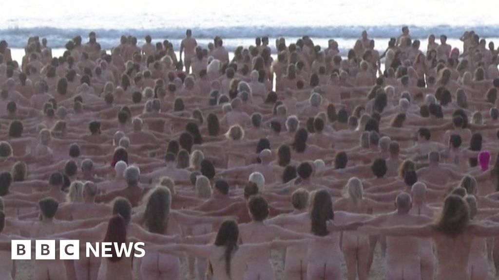 Naked volunteers pose for Bondi Beach artwork