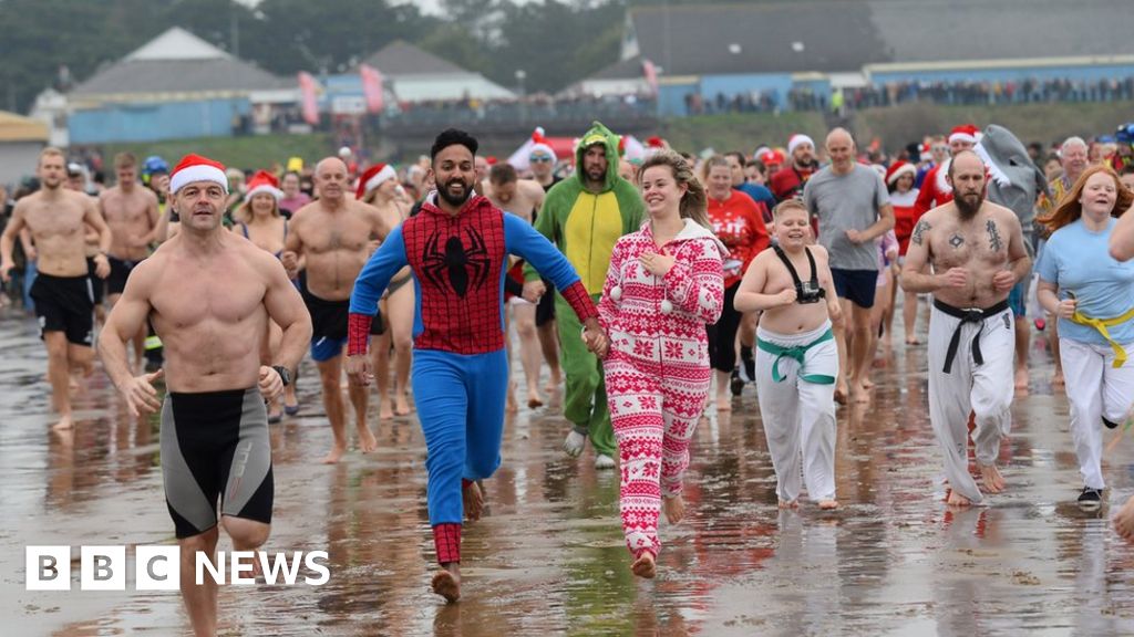 Brits brave sea swims on warmest Christmas Day on record – as