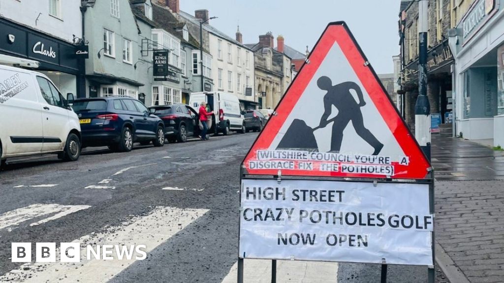 Crazy golf signs draw attention to Malmesbury potholes 