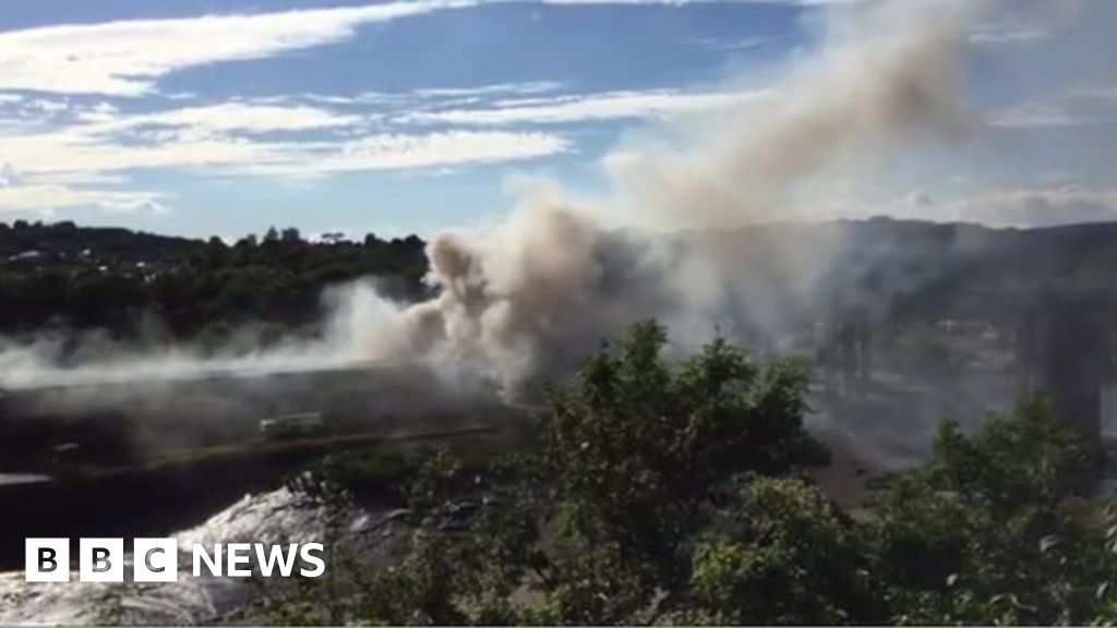 Large warehouse on fire at Chepstow skip hire company - BBC News