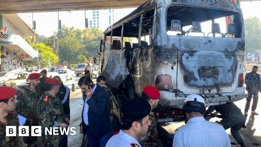 Syria war: Deadly bomb blasts hit military bus in Damascus