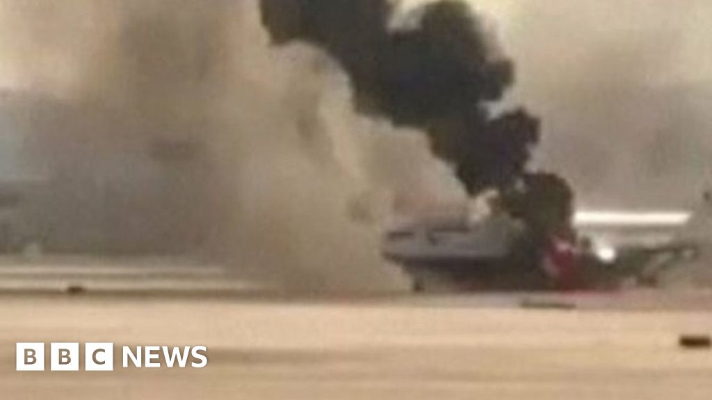 British Airways flight catches fire at Las Vegas airport - BBC News