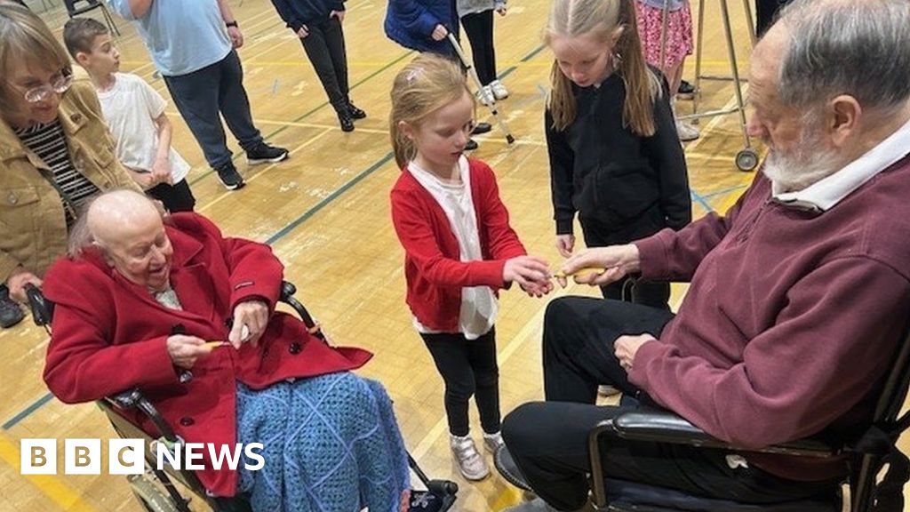 Care home residents take on Taverham pupils in sports day