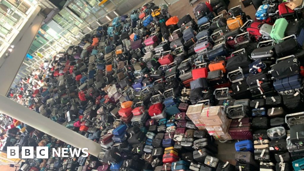 Heathrow Terminal 2 baggage piles up after malfunction