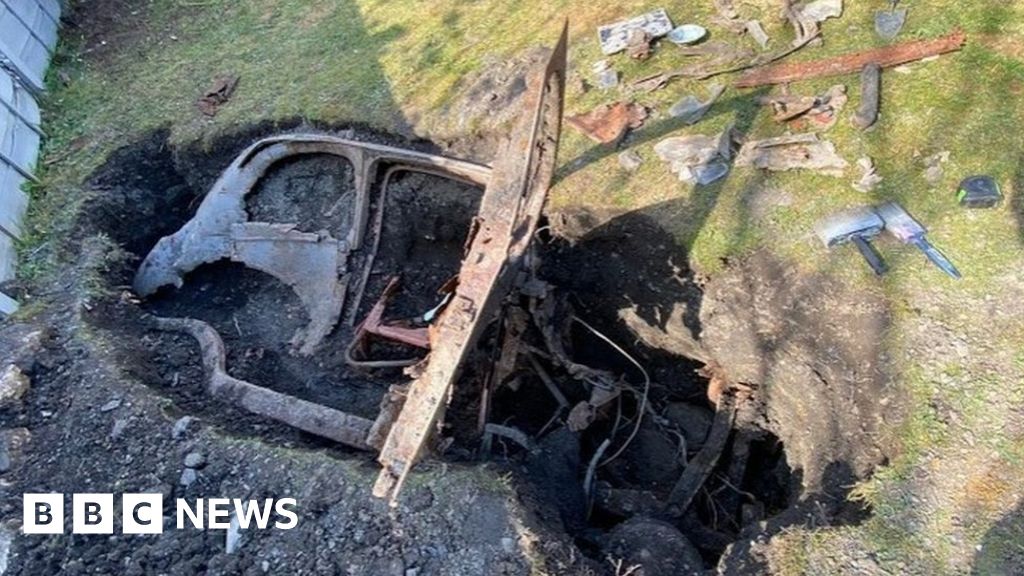 Coronavirus: Man finds old car buried in garden during lockdown ...