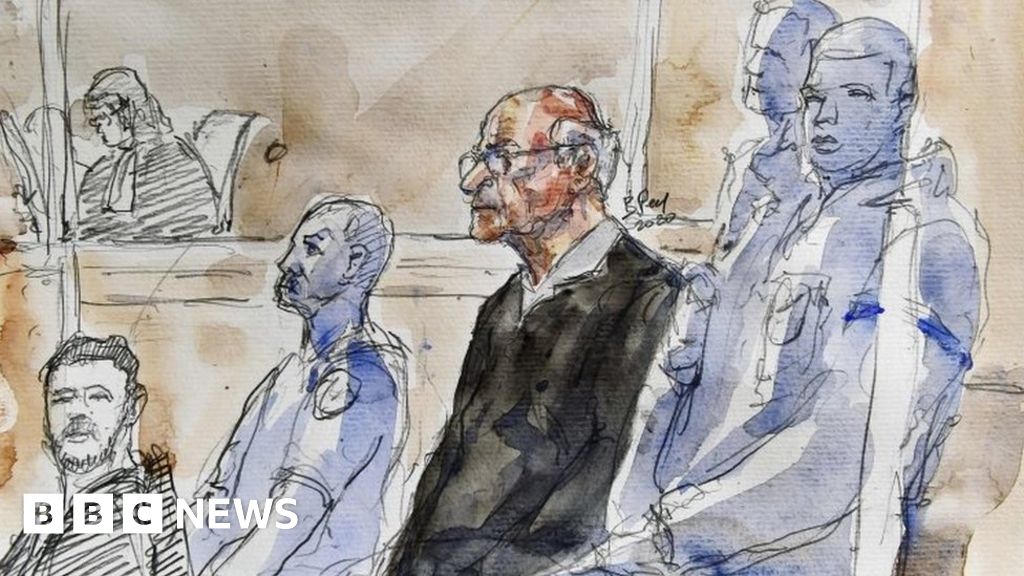 A court sketch shows Joël Le Scouarnec, (centre) sitting in the courtroom in Saintes, France. Photo: 13 March 2020