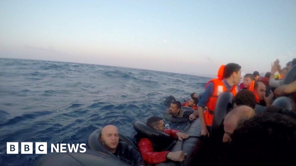 On board a refugee boat sinking into the sea - BBC News