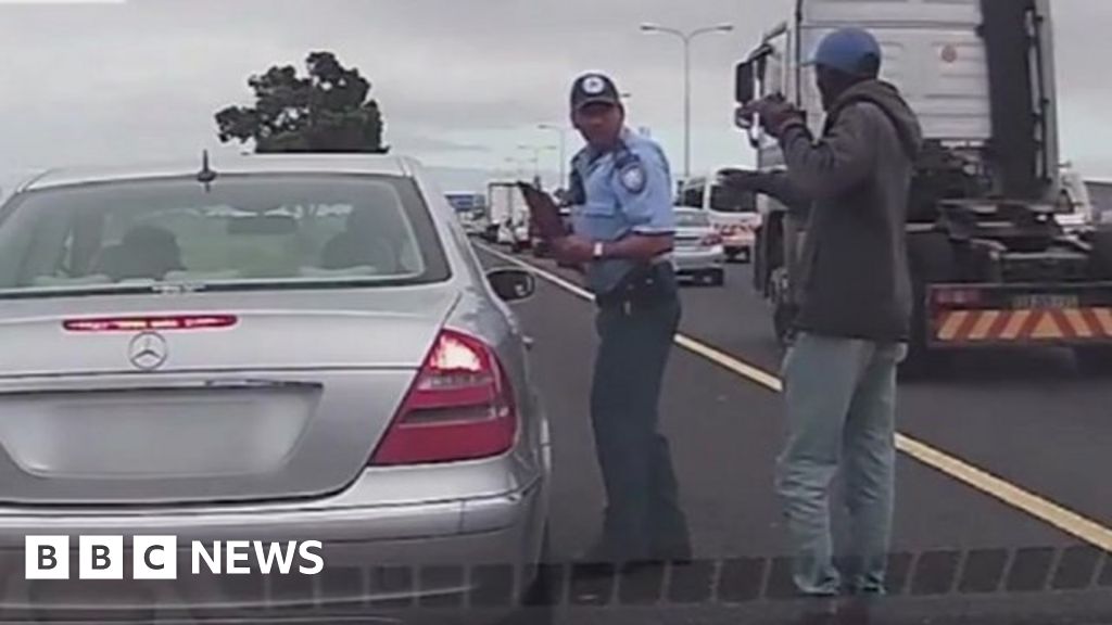 south-africa-police-officer-gets-shot-but-still-issues-a-ticket-bbc-news