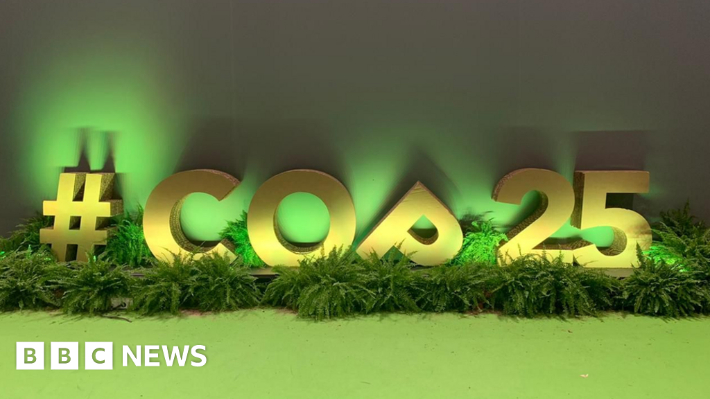 Climate change: Longest talks end with compromise deal