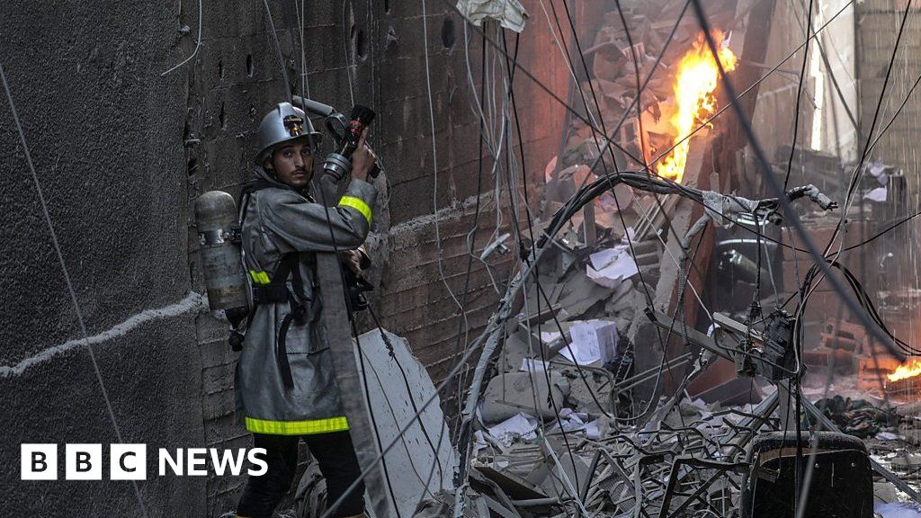 Gaza: Emergency services arrive at strike-affected flats