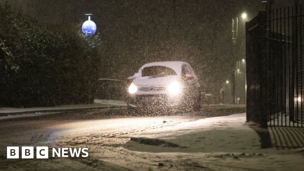 Snow and freezing rain sweep UK with amber warnings in place