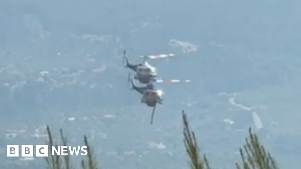 Two crew killed as British pilot survives after firefighting helicopters collide in Greece  www.bbc.com