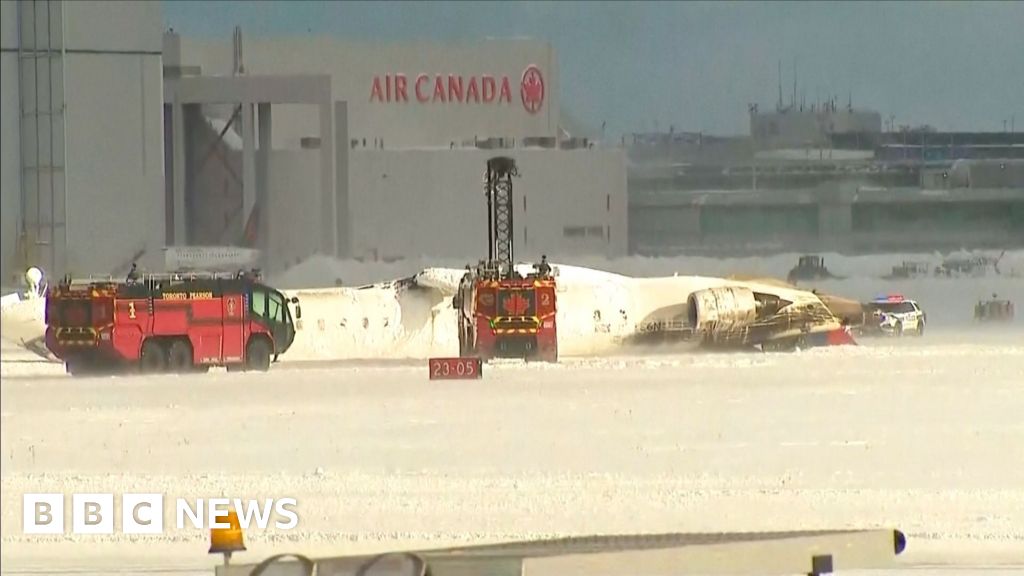 Upturned plane lies on Toronto runway after crash