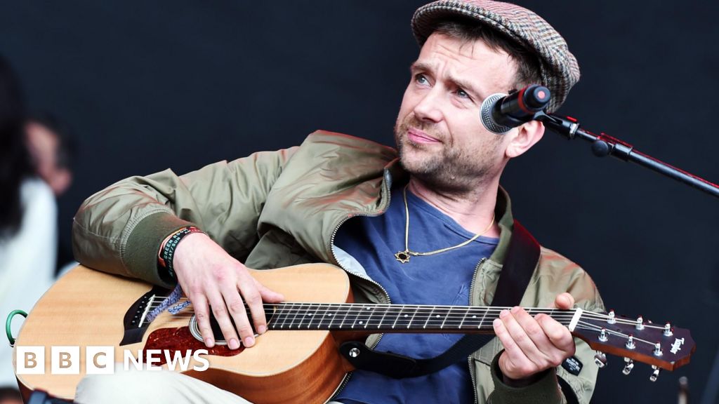 Damon Albarn donates chewed up guitar for charity auction