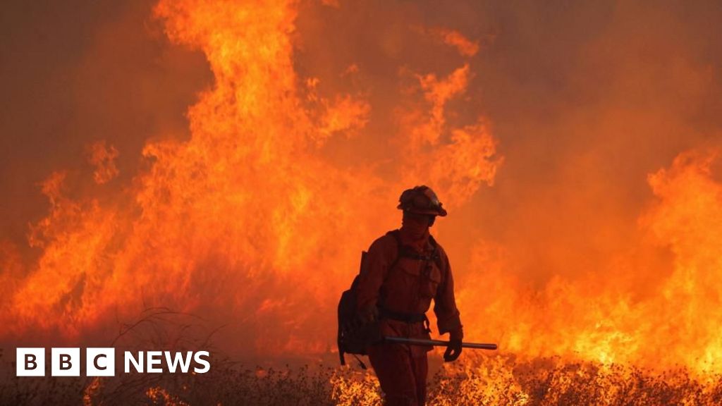 Firefighters battle huge blaze near Los Angeles as winds pick up