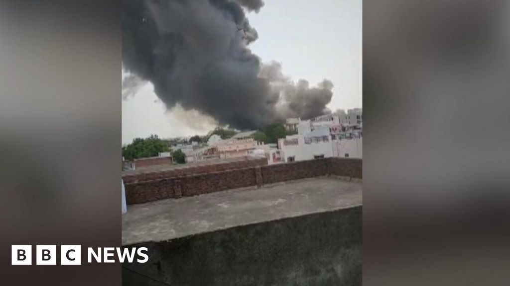 Smoke billows from Ahmedabad crash site