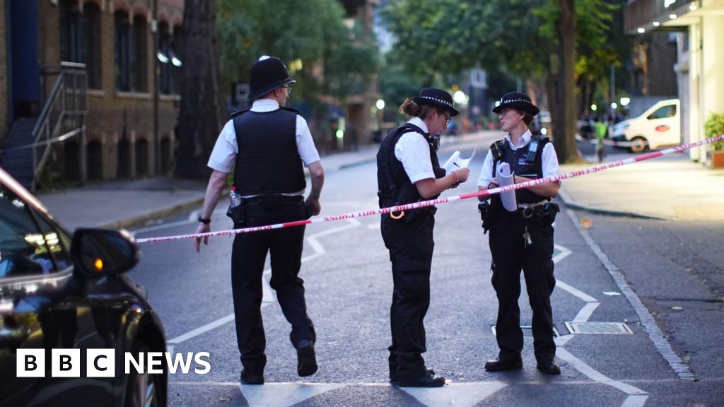 Two dead and two injured in stabbing at business