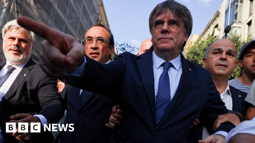 Carles Puigdemont: Police hunt ex-Catalan separatist chief after go back from exile