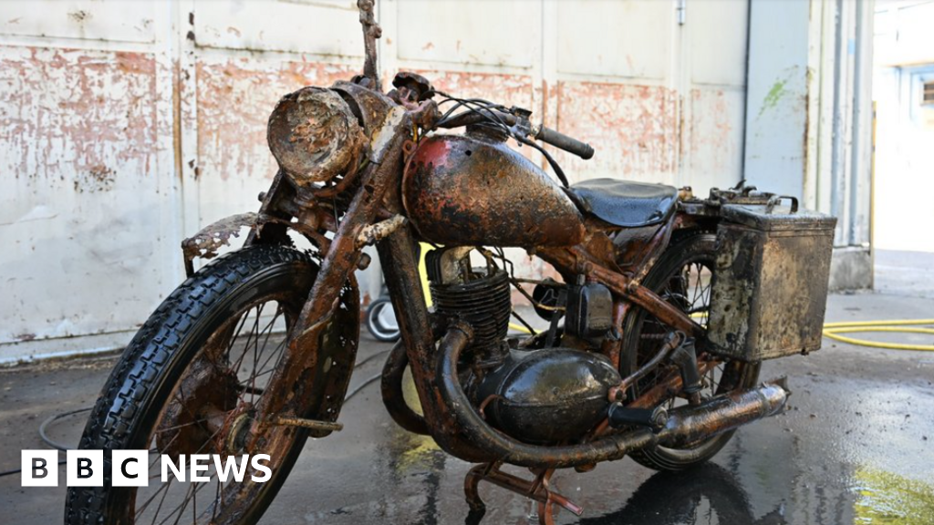 Danube's low water reveals WWII soldiers and motorcycle