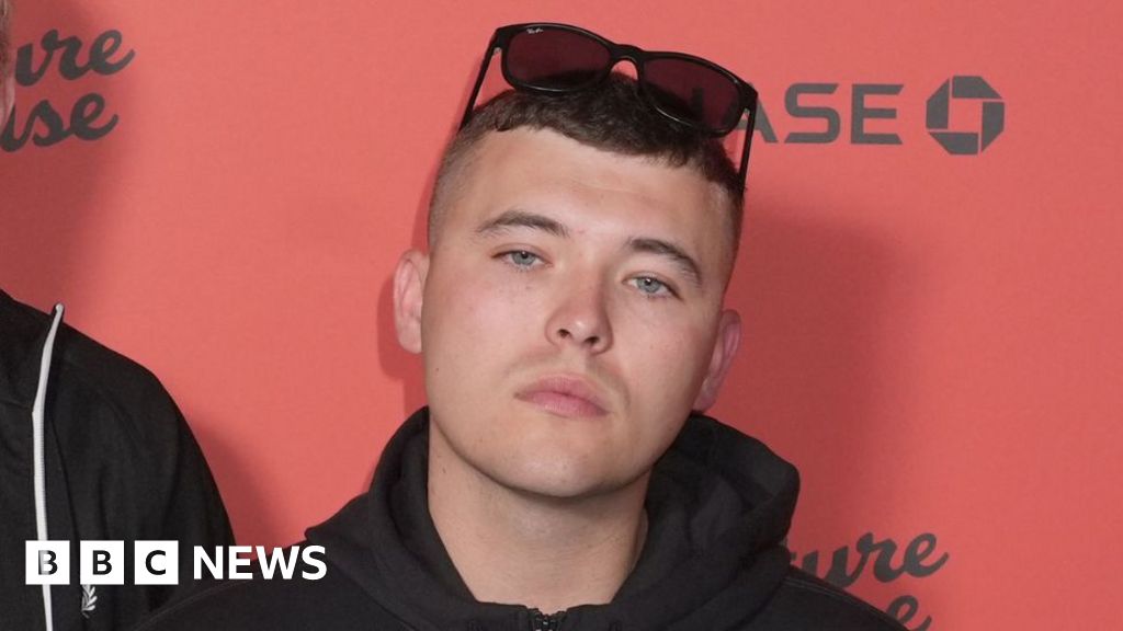 Kneecap member charged with terror offence over display of flag in support of Hezbollah