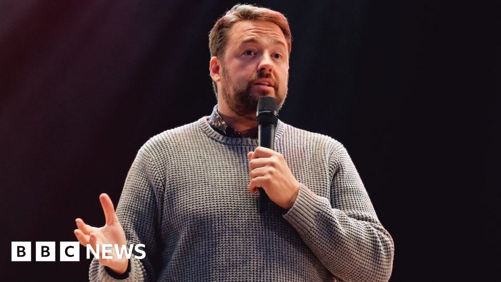 Jason Manford performing on stage