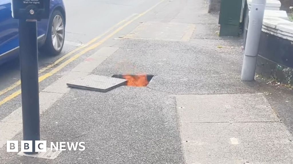 Power back on after Poole manholes blown off in fire - BBC News