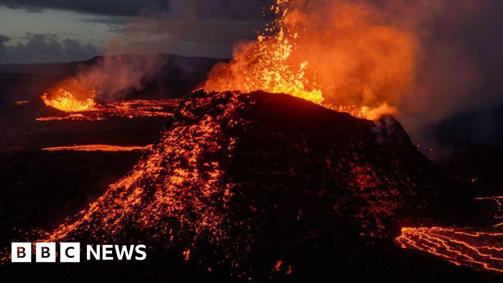 A short distance away I can see the rim of the volcano's crater lake, while to the south steam vents and mud pools bubble away. Bjorn Guðmundsso