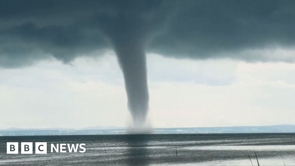 Moment huge waterspout twirls over lake in Germany