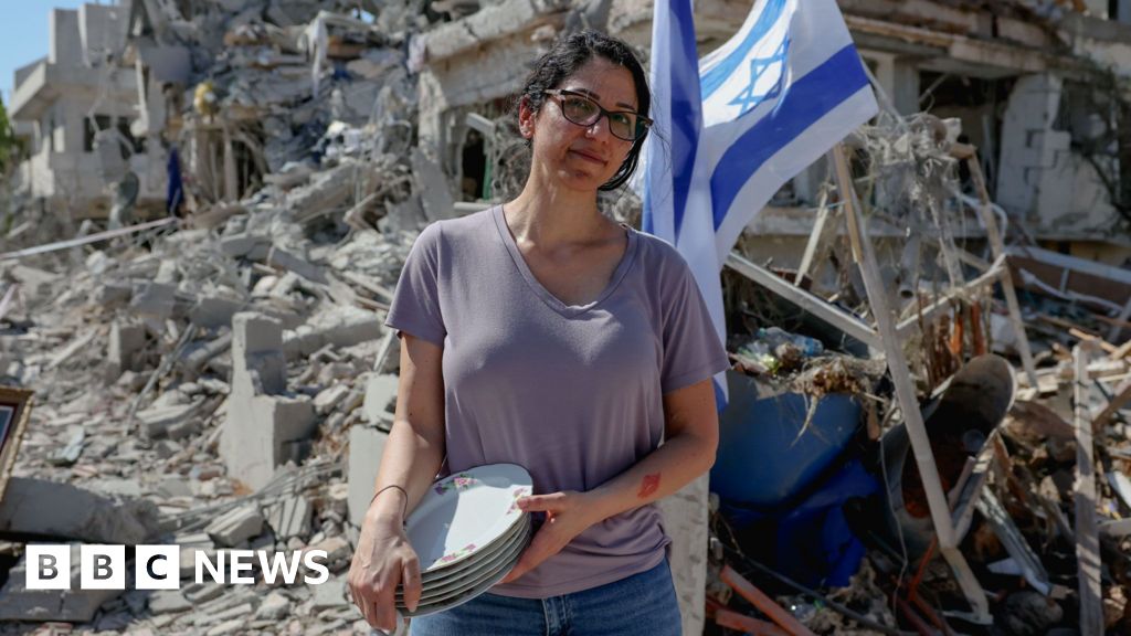 ‘It’s heavy on the heart’: Israelis survey damage after Iran missile strike