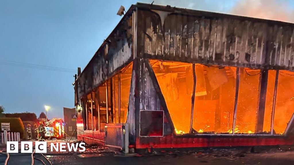 Firefighters tackling car showroom blaze