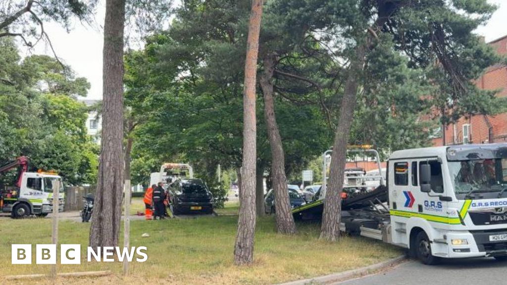 Cars parked on roundabouts by heatwave beachgoers