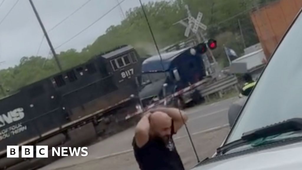Watch: Moment train plows into lorry stuck on tracks
