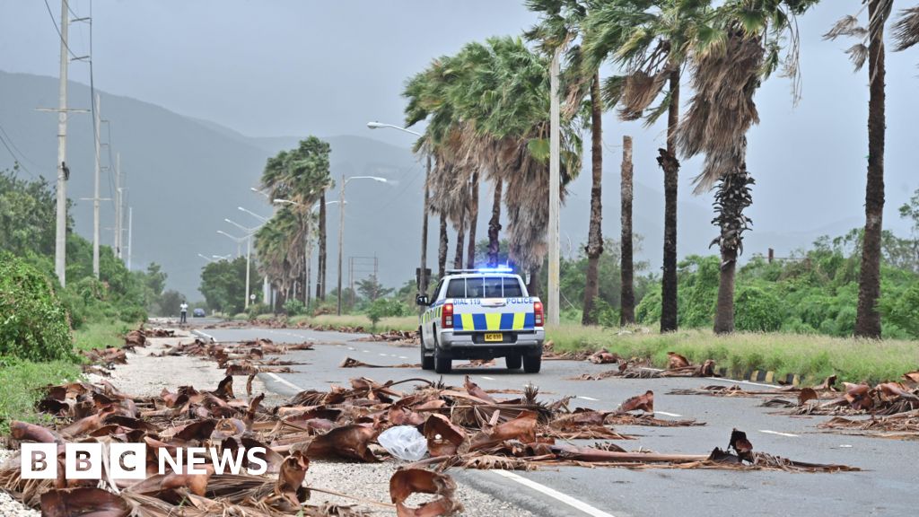 Jamaicans wake to devastation after hurricane causes floods, power cuts and splits city in two