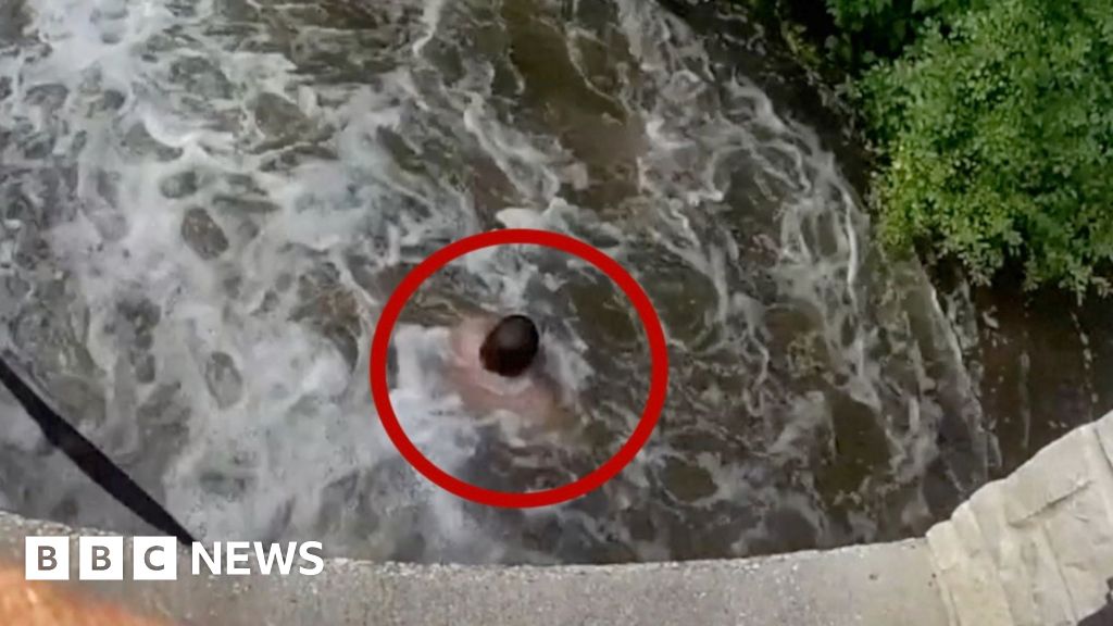 Man rescued after being swept under bridge in swollen Wisconsin river