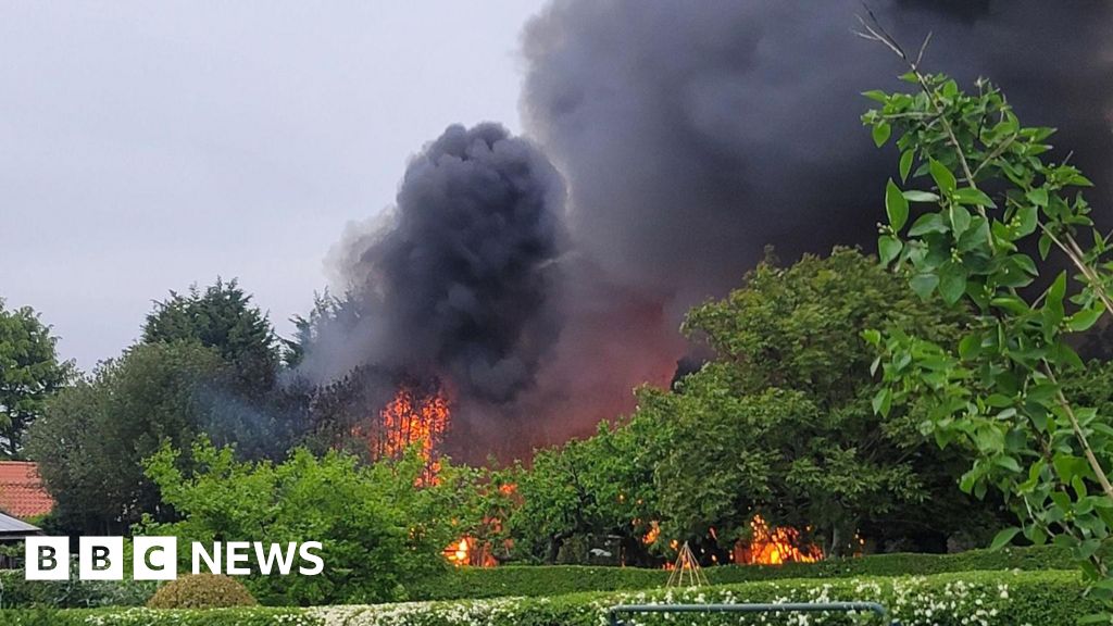 'Explosions' heard during village building fire