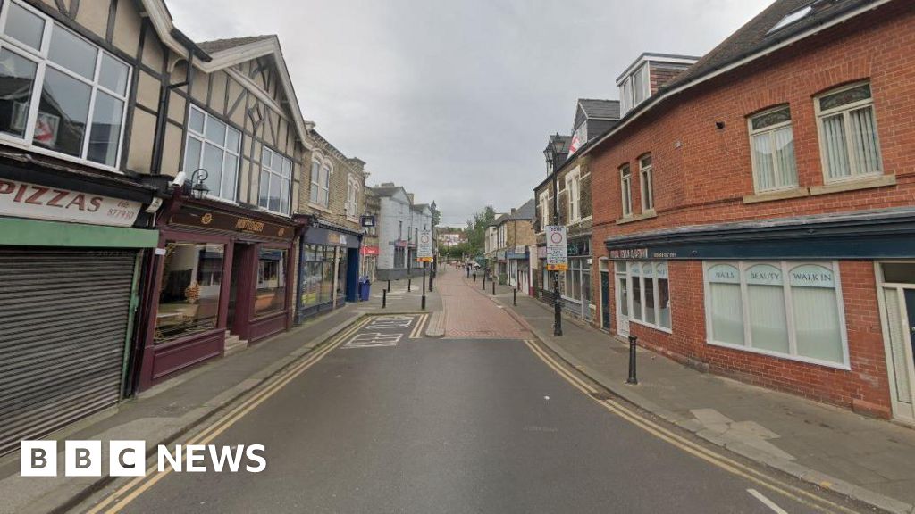 Woman, 55, injured in street shooting