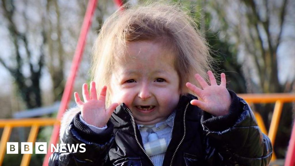 Volunteers help make a girl’s yard safe for play