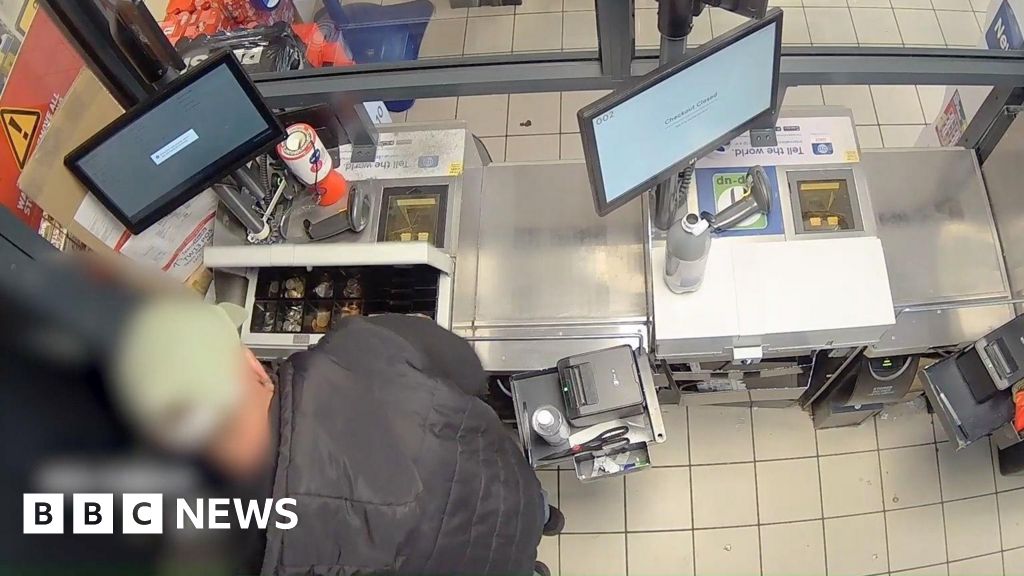 Watch: Cash till robber who threatened staff jailed