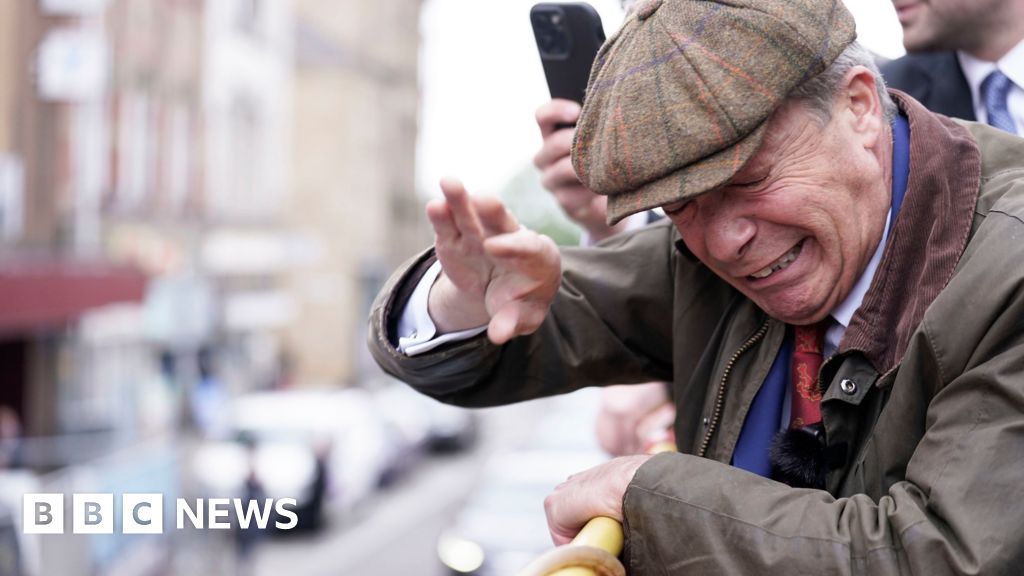 Objects thrown at Nigel Farage on open-top bus