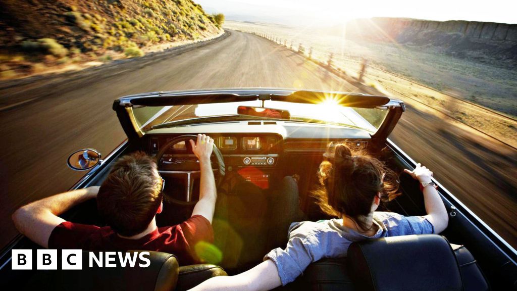 Is the convertible car heading into the sunset?