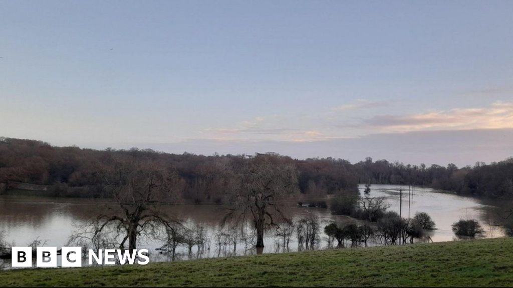 Oxfordshire: Floods close schools, halt trains and submerge roads