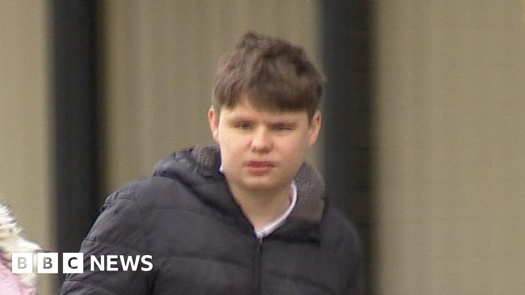 A TV image of Thomas Waller leaving Staines Magistrates Court. He has brown hair and is wearing a black puffer jacket.