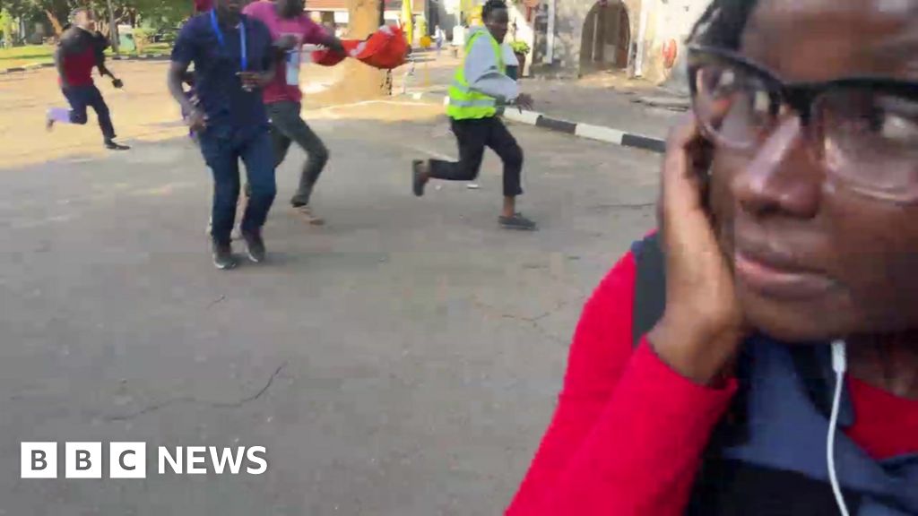 Live BBC report interrupted by man with gun in Nairobi