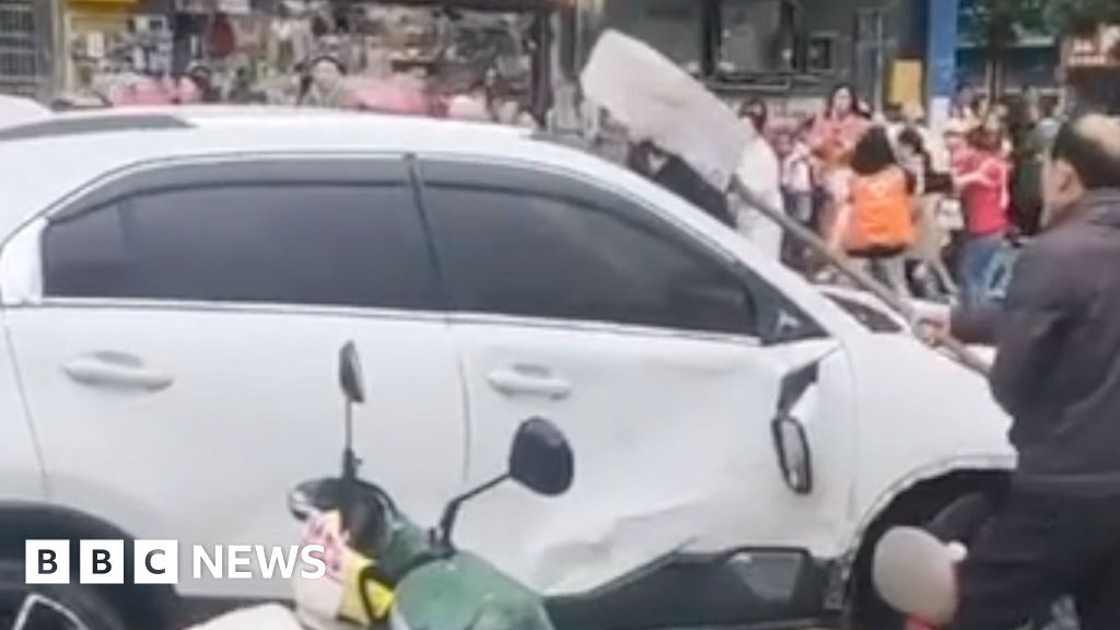 Car driven into crowd outside China primary school