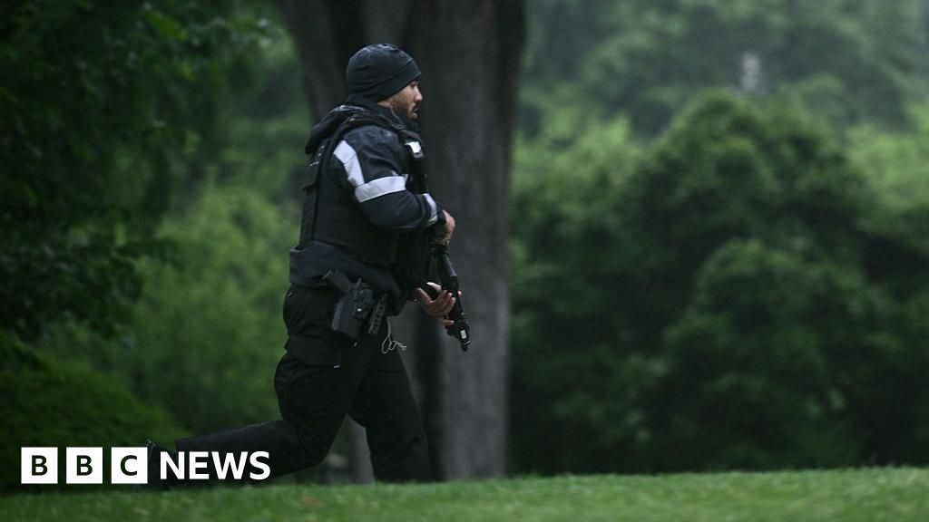 Journalists run for cover as they report possible gunfire near White House